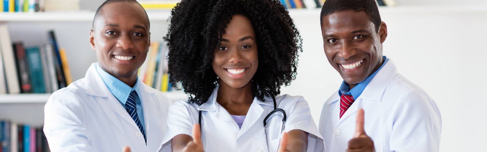 medical doctors doing thumbs up