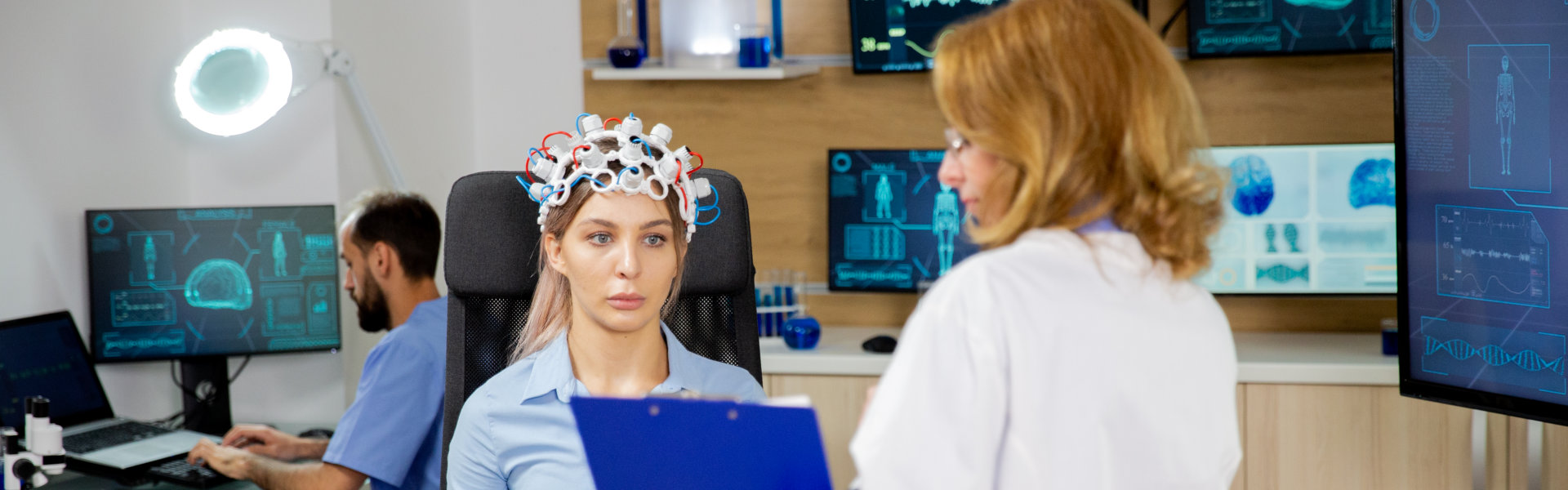 patient with brain waves being scanned by her doctor